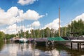 Sailboats and motor boats docked at the jetty of Van Dusseldorf yacht yard